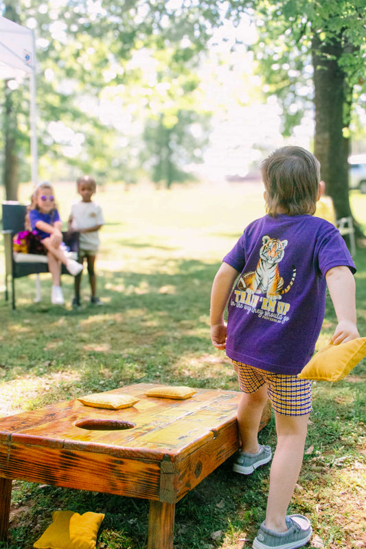 *PREORDER* Train up a Tiger | Football Kid’s Tee | Purple + Gold